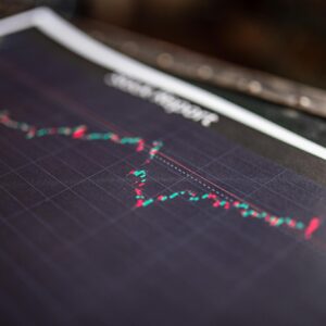 Close-up of a stock report showing a financial data graph.